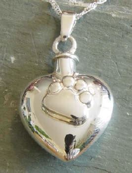 Pet cremation jewelry is becoming increasingly popular as a way to keep our pet's memory near, because sometimes the traditional urn on the shelf feels too cold and distant. Paw Print Heart Pet Urn Necklace - Memorial Urns