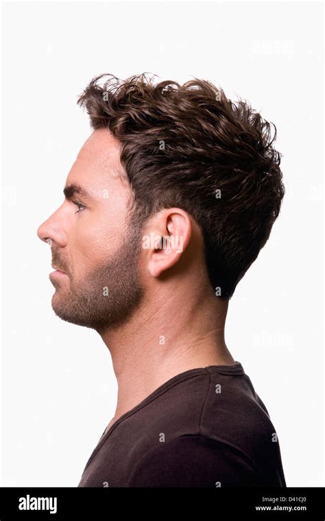 Side Profile Of A Handsome Caucasian Male Model Wearing A Tight Stock