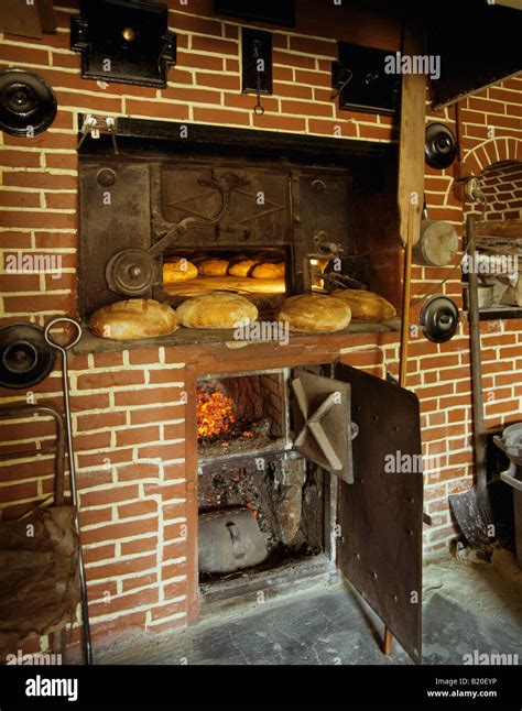 Baking Bread In A Wood Fired Oven La Roquette Near Perigueux Dordogne