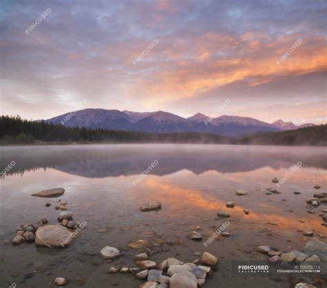 Sunset Over Patricia Lake Water In Jasper National Park Alberta