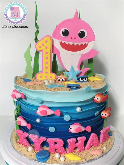 Baby shark, mama shark, papa shark, grandma shark, and grandpa shark are out for a family swim and baby shark tries and tries to catch the little fishies but his skills aren't yet up to the task. Baby shark fondant cake in 2020 | Shark birthday cakes ...
