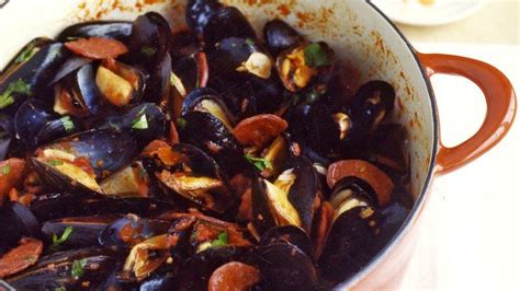 sweet plump mussels are steamed in a sauce made with tomatoes garlic red chile flakes and
