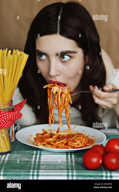 Woman Eating Pasta In Restaurant Stock Photo Alamy