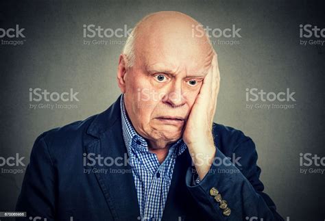 Portrait Of Elderly Desperate Sad Man Stock Photo Download Image Now