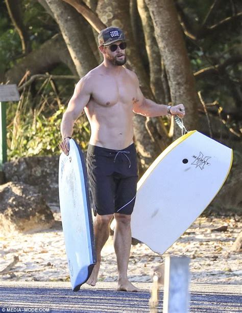 Chris Hemsworth Showcases His Muscular Build Shirtless At The Beach
