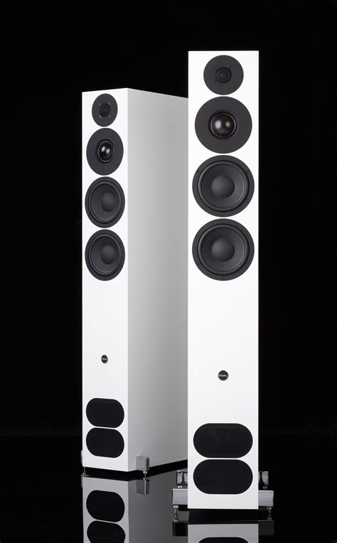 Two White Speakers Sitting Next To Each Other