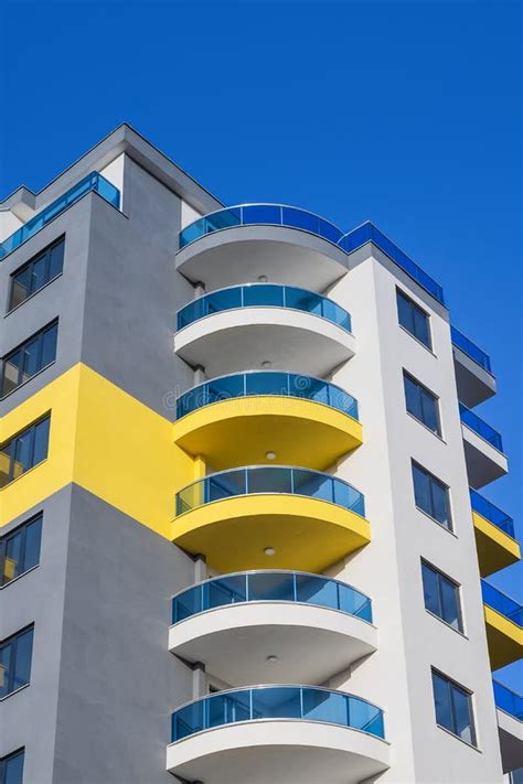 The Upper Part Of A Tall Residential Building With Semicircular