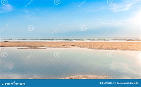 Beautiful Calmness Sea With Bright Blue Sky And Reflection On The Water