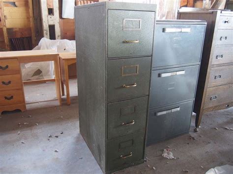 In the most simple context, it is an enclosure for drawers in which items are stored. Army Green Metal Filing Cabinet