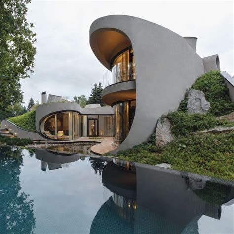 Futuristic Organically Shaped Home Balances Architectural And Natural