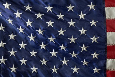 Close Up Of Stars Of An American Flag With A Hint Of The Stripes By