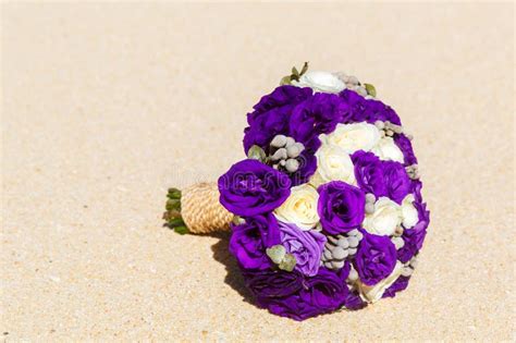 Wedding Bouquet Lying On The Sand On A Tropical Beach Stock Image