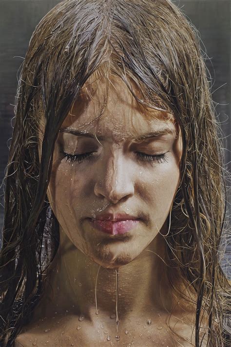 A Woman With Wet Hair And Water On Her Face