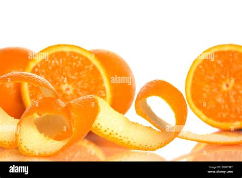 Spiral Orange Peel And Juicy Oranges On White Background Stock Photo
