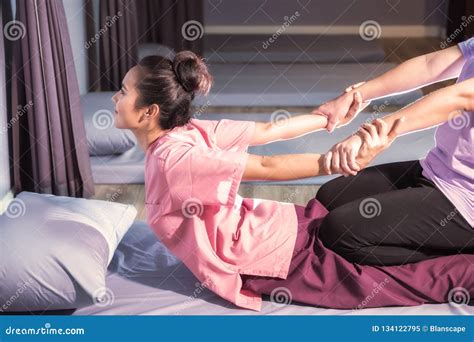 Thai Massage Therapist Is Massaging A Woman Arm In Spa Stock Image 103794895