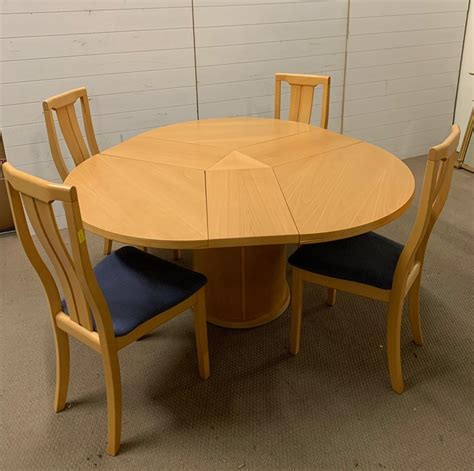 A Skovby Round Extending Dining Table Made In Denmark With Four Chairs