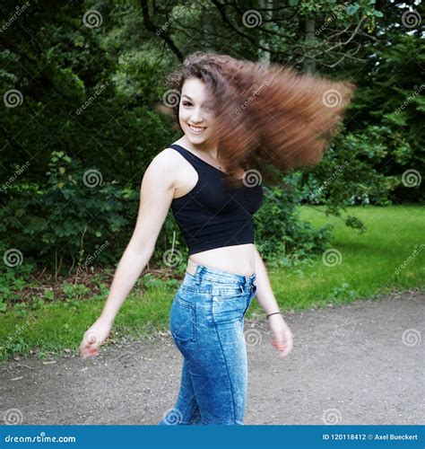 Playful Young Woman Swinging Her Hair Stock Photo Image Of Carefree
