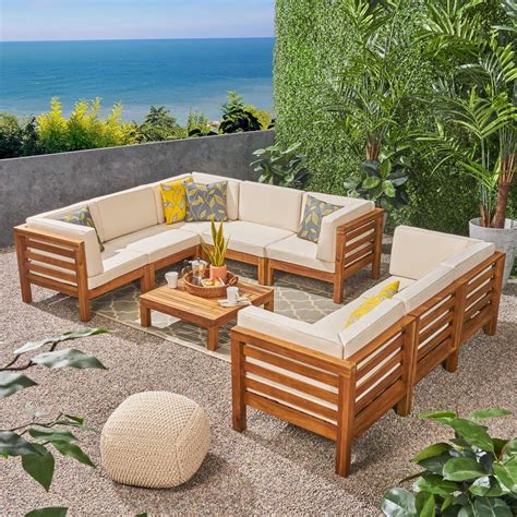 Product title anderson teak rialto 4 person teak patio dining set average rating: Noble House Jonah Teak 9-Piece Wood Outdoor Sectional Sofa Set with Beige Cushions-307083 - The ...