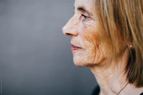 Profile Portrait Of A Wrinkled Senior Woman. by BONNINSTUDIO - Boomer