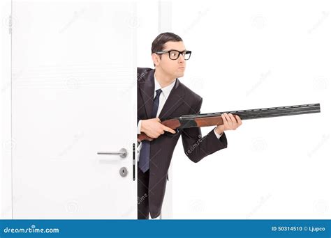 Businessman Holding Rifle And Entering A Room Stock Photo Image Of