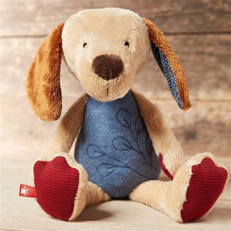 Kuscheltiere werden auch stofftier oder plüschtier genannt. Dieser süße Welpe hat's faustdick hinter den Kuschelohren ...