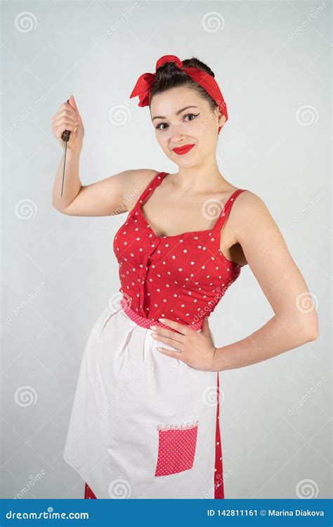 Dangerous Pin Up Girl Housewife In Red Vintage Polka Dot Dress Stands