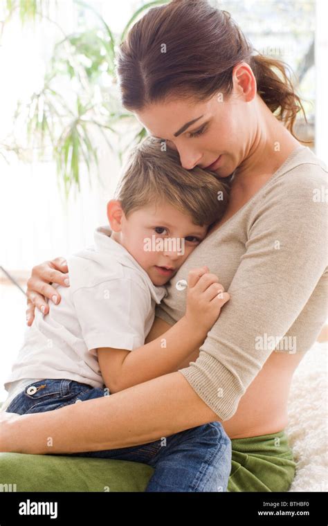 Mother Hugging Sad Son Stock Photo Royalty Free Image Alamy