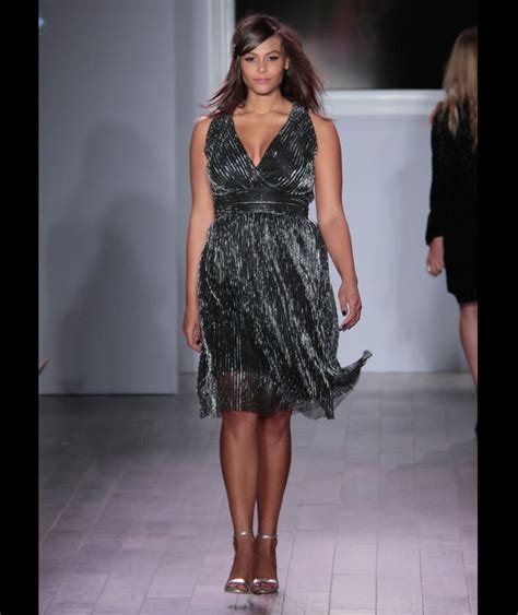 A Plus Size Model Walks The Runway As She Models Clothing