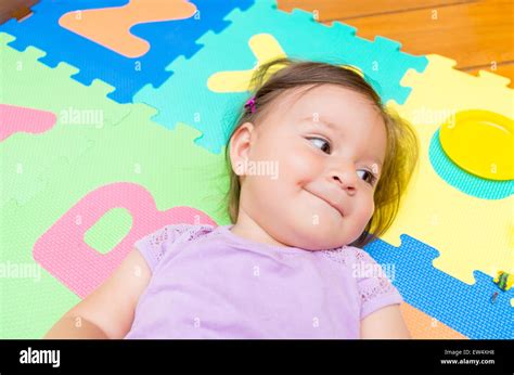 Adorable Baby Girl Lying Smiling Stock Photo Alamy