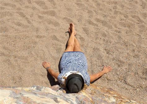 Woman Stretched Out On The Sand Aerial View Vertical Stock Photo Image Of Space Stretched