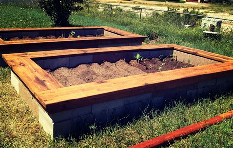 A cinderblock garden is easy to create and can be very versatile. Cinder block raised bed gardens with wood trimmed bench ...