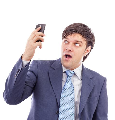 Young Businessman Holding A Mobile Phone And Looking Surprised Stock