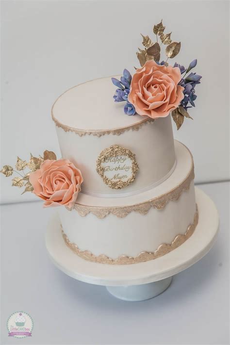Gold And White Cake With Handmade Peach Coloured Roses