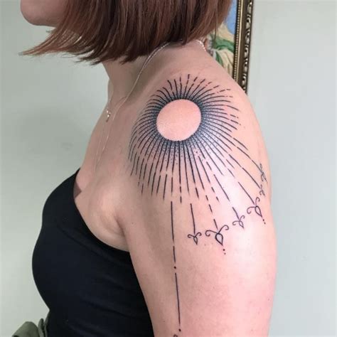 Sunburst Tattoo Meaning Placement And Design Ideas Tattoo Twist