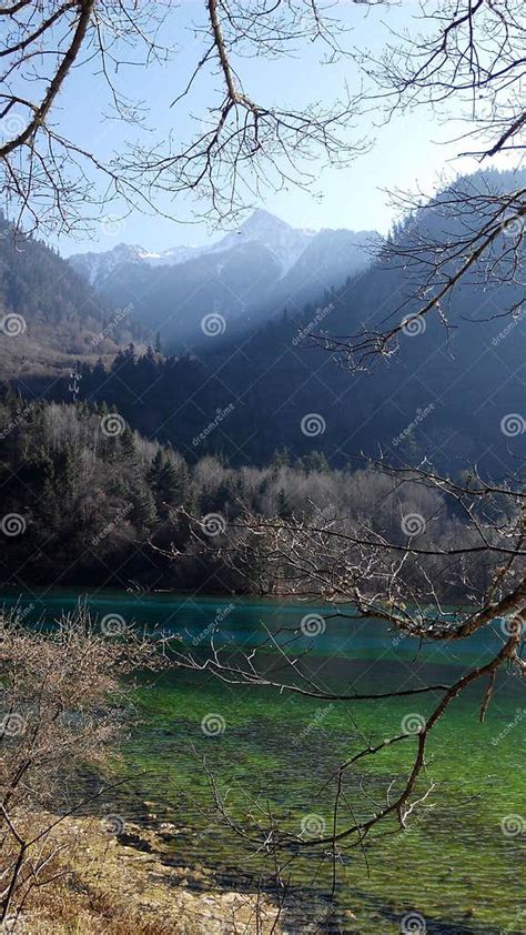 Lake With Clear Crisp Water Surrounded With Mountaineous Scenery Stock