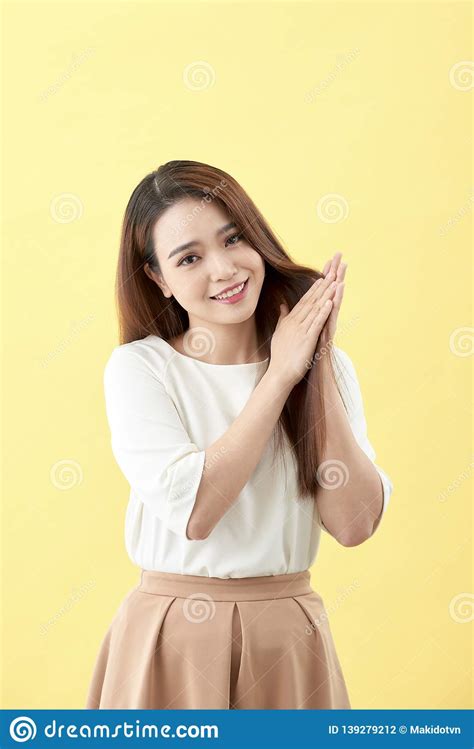 Asian Young Beautiful Woman Smiling And Touching Smooth Her Hair