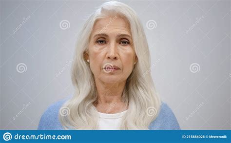 Old Woman Feeling Upset In Studio Confused Lady Shrugging Shoulders
