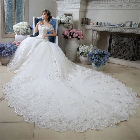 luxury beaded sequins bodice boat neck floor length white arab ball gown cathedral train wedding