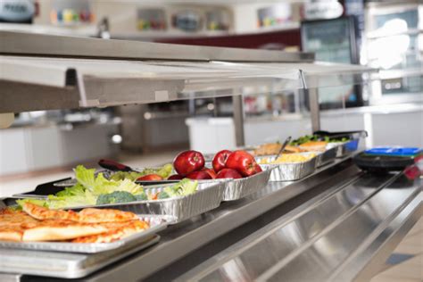 School Cafeteria Line With Healthy And Unhealthy Food Choices Stock