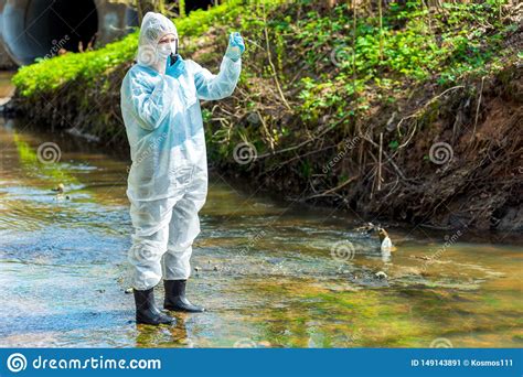 A Scientist With A Sample Of Contaminated Contaminated Water With A Walkie-talkie Warns About ...