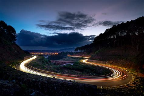 Time Lapse Photography Of Vehicles Passing By Curved Road · Free Stock