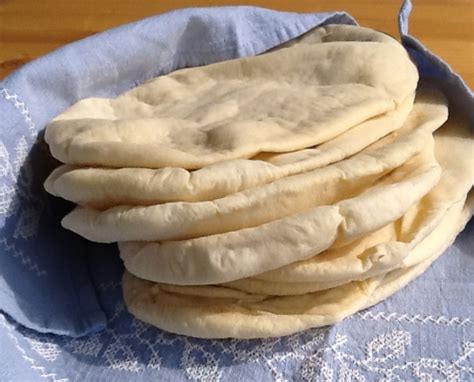 Knead the dough, by hand (10 minutes) or by mixer (5 minutes) or by bread machine (set on the dough cycle) until it's smooth. Homemade Pitta Bread | Recipe | Bread, Food recipes, Food