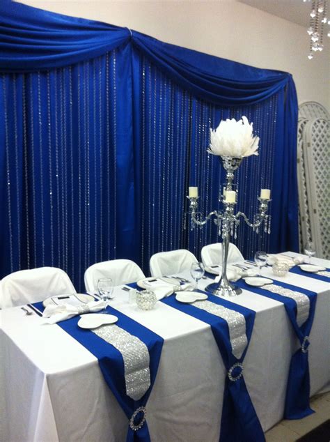 Head Table With Royal Blue Back Drop And Crystal Step Curtains Royal