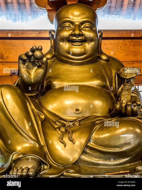 Buddha Of Abundance And Happiness A Gold Statue Of A Laughing Buddha