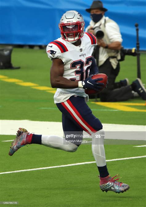 Safety Devin McCourty Of The New England Patriots Runs The Ball Into