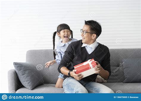 Check spelling or type a new query. Asian Father Give Present For Daughter. Concept Surprise ...