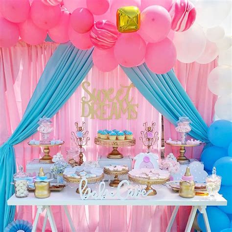 Adorable Gender Reveal Dessert Table With A Stunning Pink Blue And Gold Color Palate By