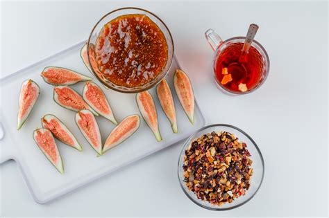 Free Photo Figs With Fig Jam Tea Teaspoon Dried Herbs Top View On