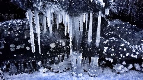 Icicles Are Hanging From The Side Of A Building In Winter Time With
