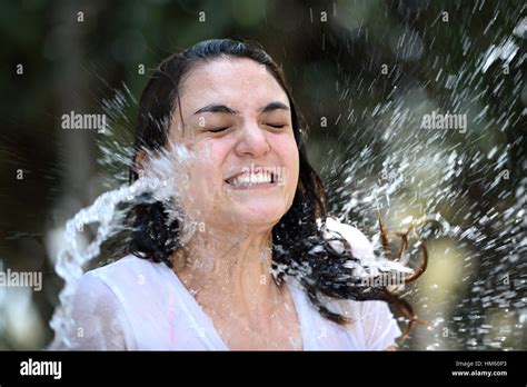 Face Girl In Water Splashes In Blurred Background Stock Photo Alamy
